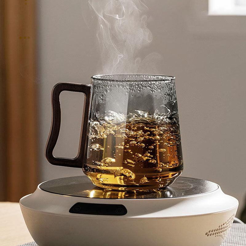 https://juglana.de/cdn/shop/files/heat-resistant-tea-mug-or-wood-lid-metal-infuser-or-toned-glass-juglana-5.jpg?v=1690134922